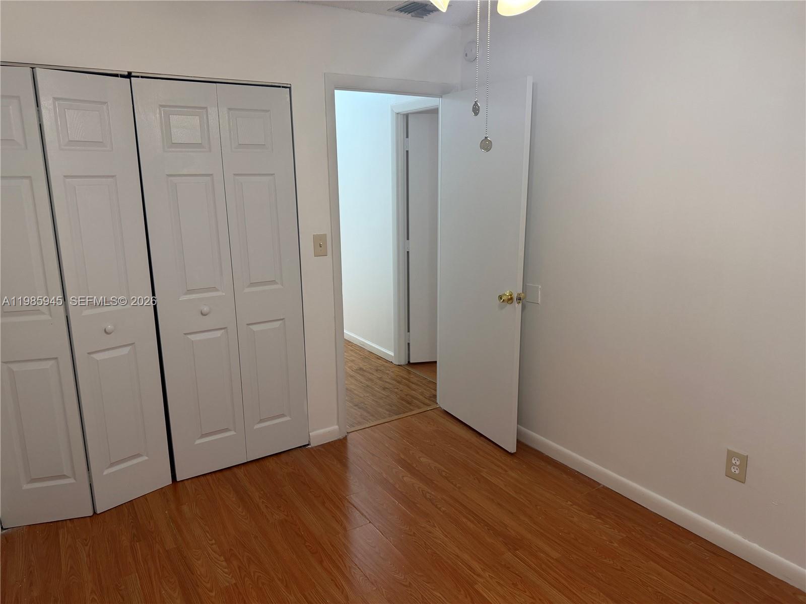 3962 Inverrary Drive, Unit A3 Lauderhill, FL 33319 - Photo 38 of 42 a view of a hallway with wooden floor