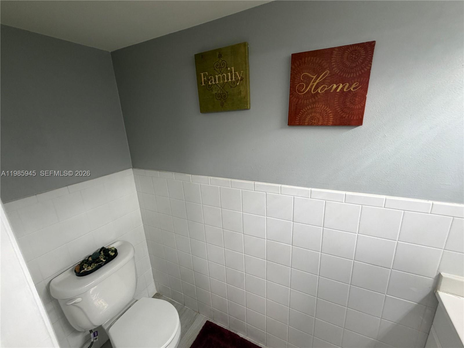 3962 Inverrary Drive, Unit A3 Lauderhill, FL 33319 - Photo 9 of 42 a bathroom with a toilet and a shower