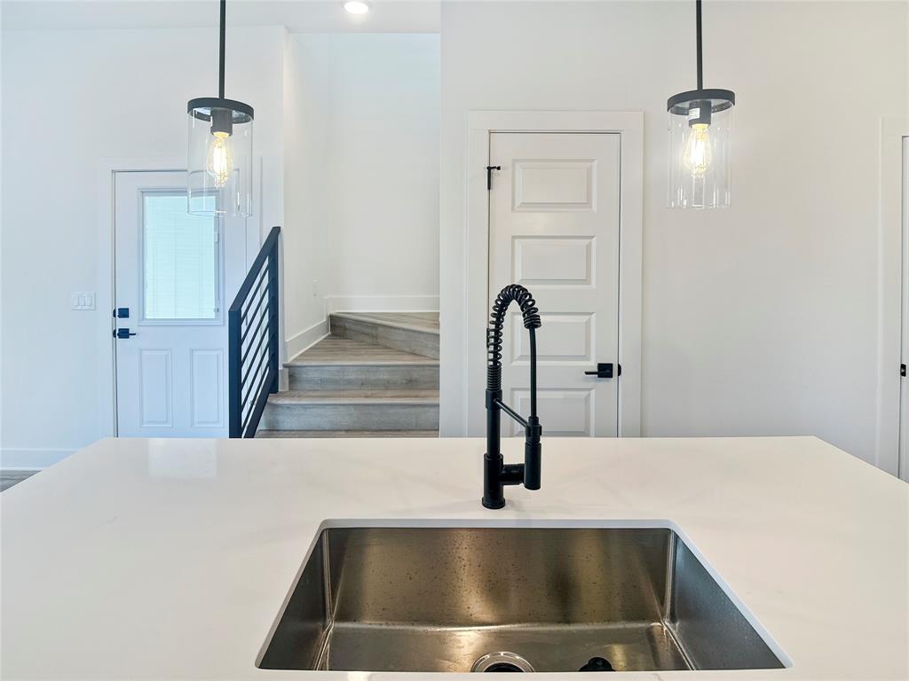 6107 Begonia Circle, Unit 2 Austin, TX 78741 - Photo 2 of 15 Kitchen view of a sink and pendant lighting