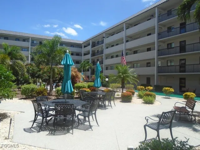 a view of an chairs and table in patio of the house