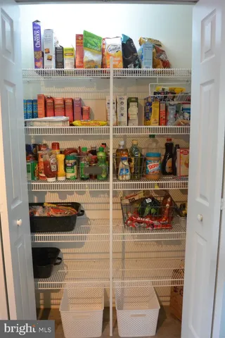 a kitchen with stainless steel appliances granite countertop a sink stove and wooden cabinets
