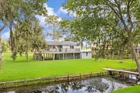 a view of a house with a big yard