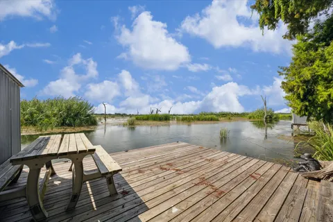 a lake view with a wooden bridge