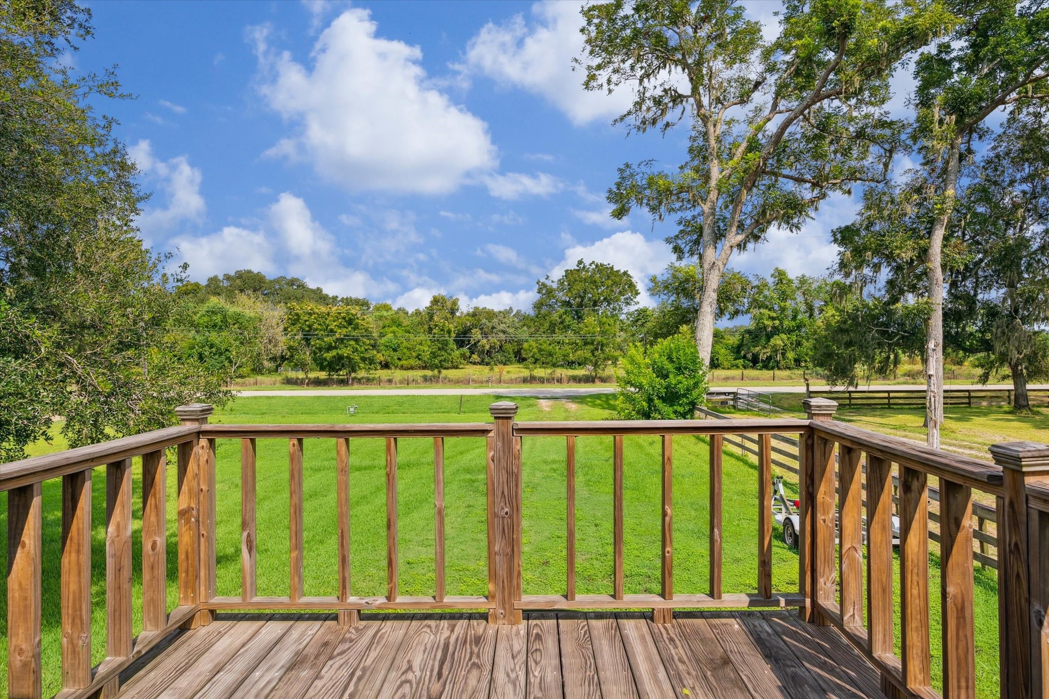 29331 County Road 25 Damon, TX 77430 - Photo 24 of 26 a view of balcony with yard and trees