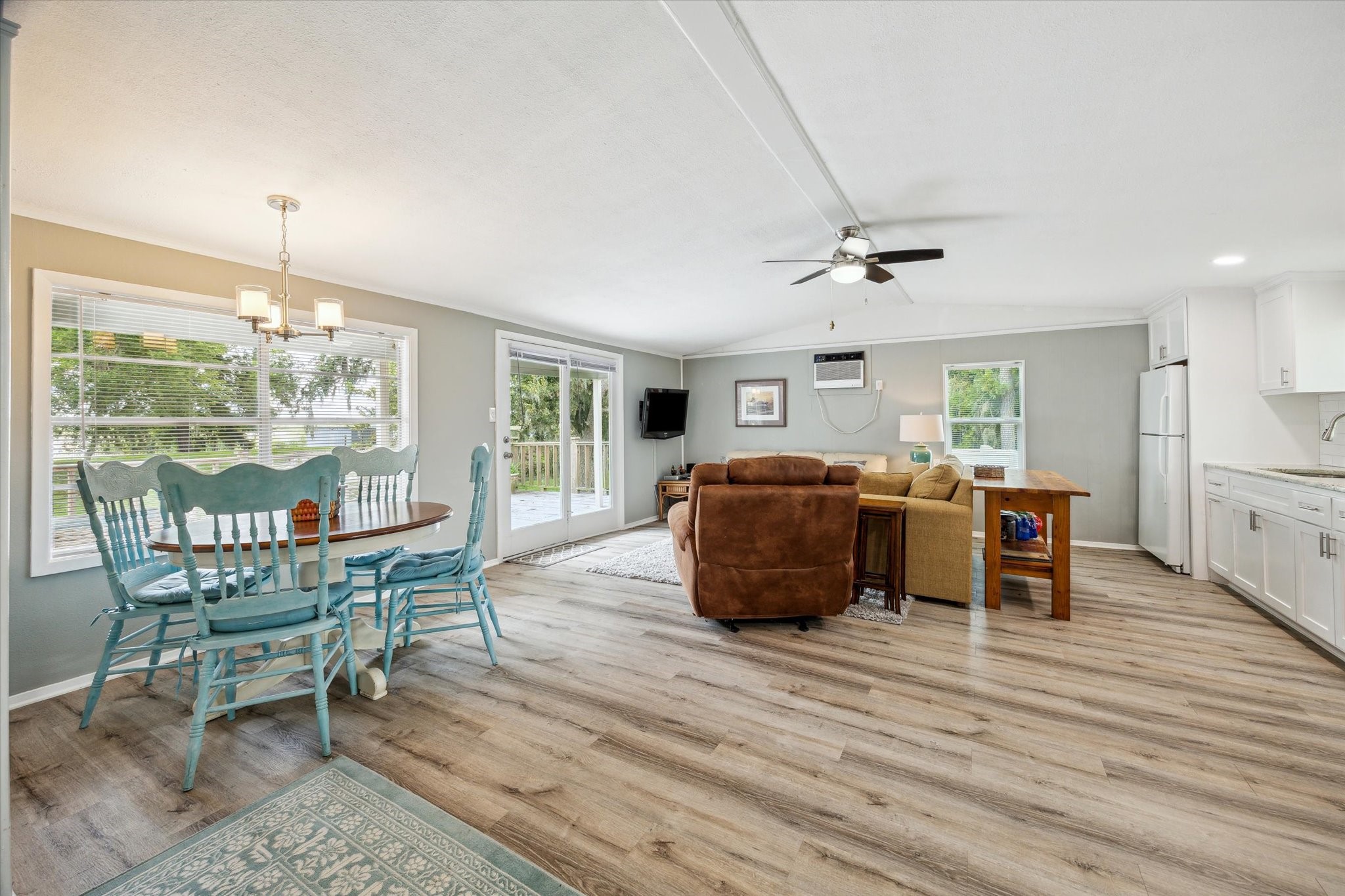 29331 County Road 25 Damon, TX 77430 - Photo 6 of 26 a living room with furniture a dining table and chairs with wooden floor