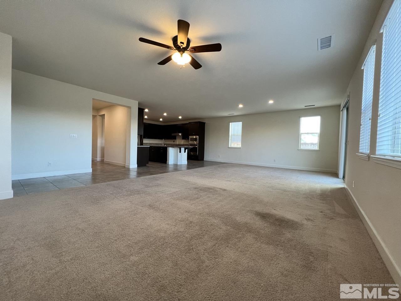 1765 Scott Valley Road Reno, NV 89523 - Photo 13 of 23 a view of a livingroom with a ceiling fan and window