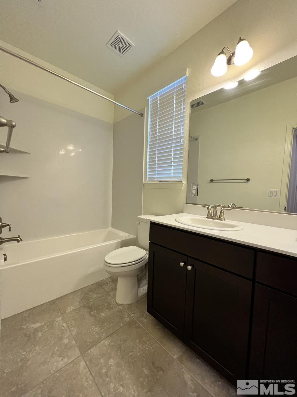 1765 Scott Valley Road Reno, NV 89523 - Photo 16 of 23 a bathroom with a sink a toilet and a bathtub