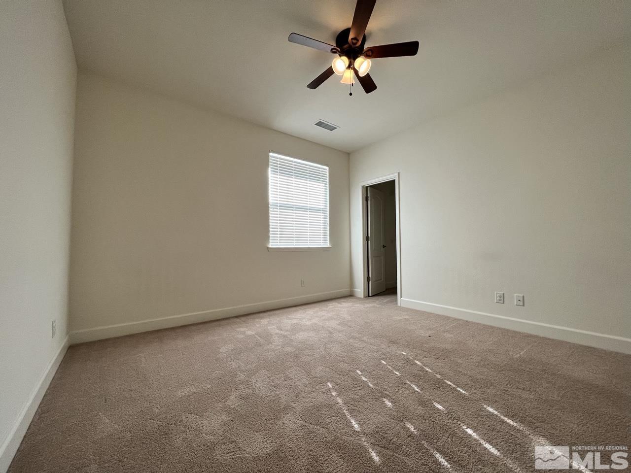 1765 Scott Valley Road Reno, NV 89523 - Photo 17 of 23 an empty room with windows and fan