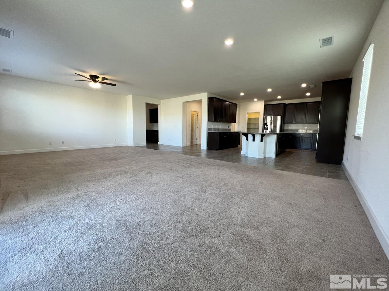 1765 Scott Valley Road Reno, NV 89523 - Photo 3 of 23 a view of a kitchen with a sink and a refrigerator