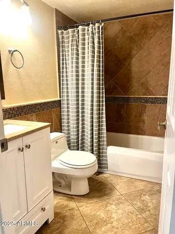 a bathroom with a toilet a sink and a shower