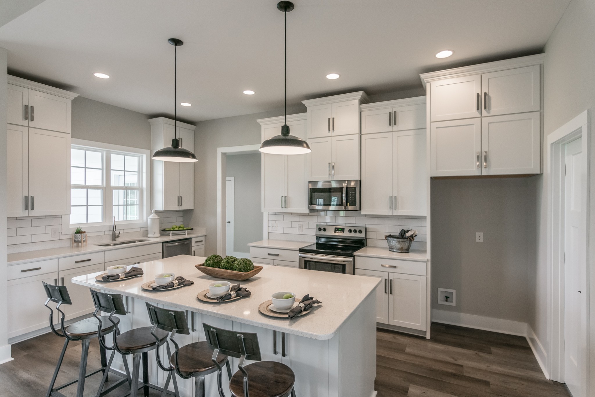 7866 Mill Road Cross Plains, TN 37049 - Photo 19 of 42 a kitchen with kitchen island granite countertop a sink a center island stainless steel appliances and cabinets