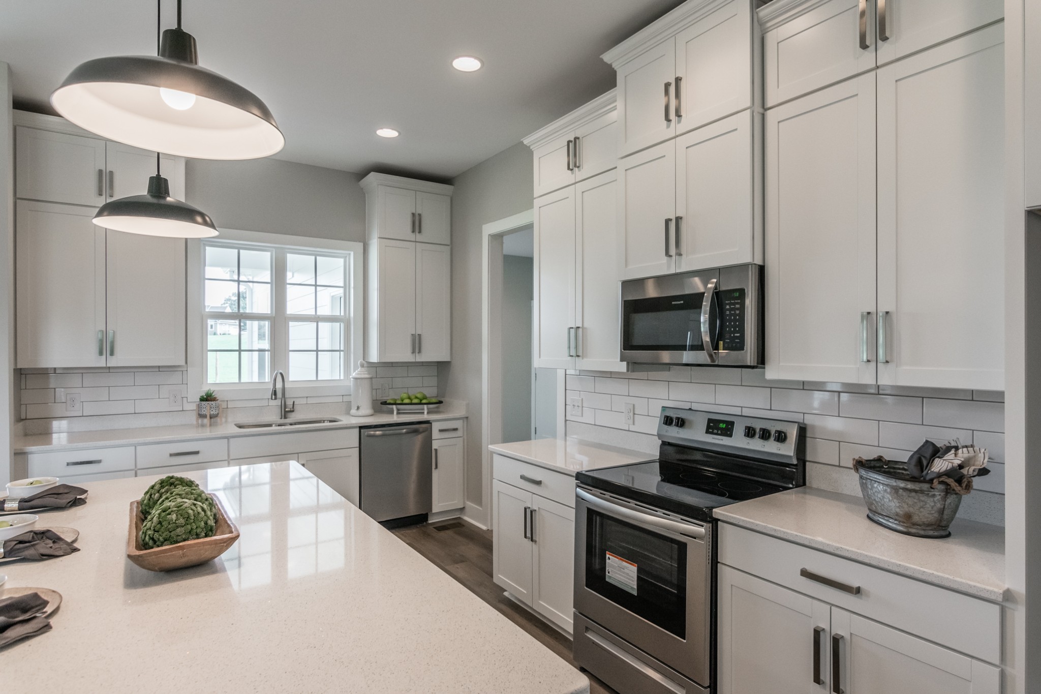 7866 Mill Road Cross Plains, TN 37049 - Photo 20 of 42 a kitchen with stainless steel appliances granite countertop a sink a stove and a refrigerator