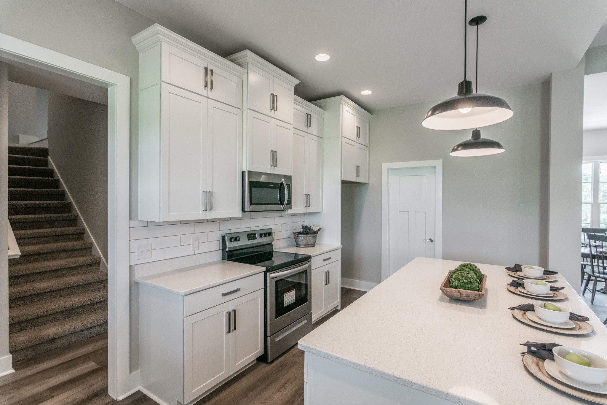 7866 Mill Road Cross Plains, TN 37049 - Photo 21 of 42 a kitchen with stainless steel appliances kitchen island granite countertop a sink and a refrigerator