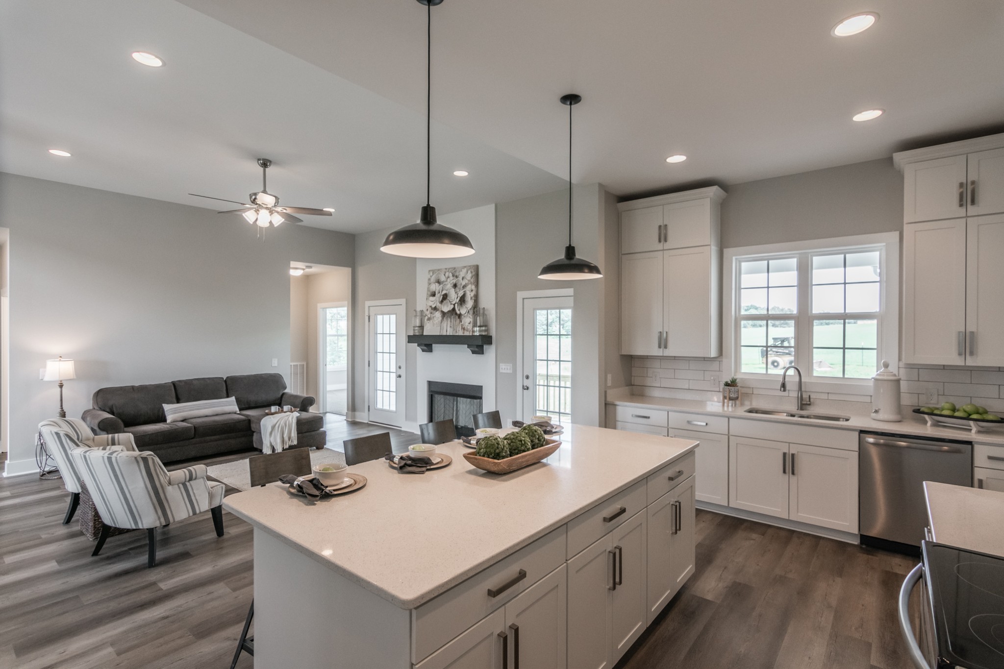 7866 Mill Road Cross Plains, TN 37049 - Photo 23 of 42 a kitchen with stainless steel appliances kitchen island granite countertop a sink a stove a dining table and chairs