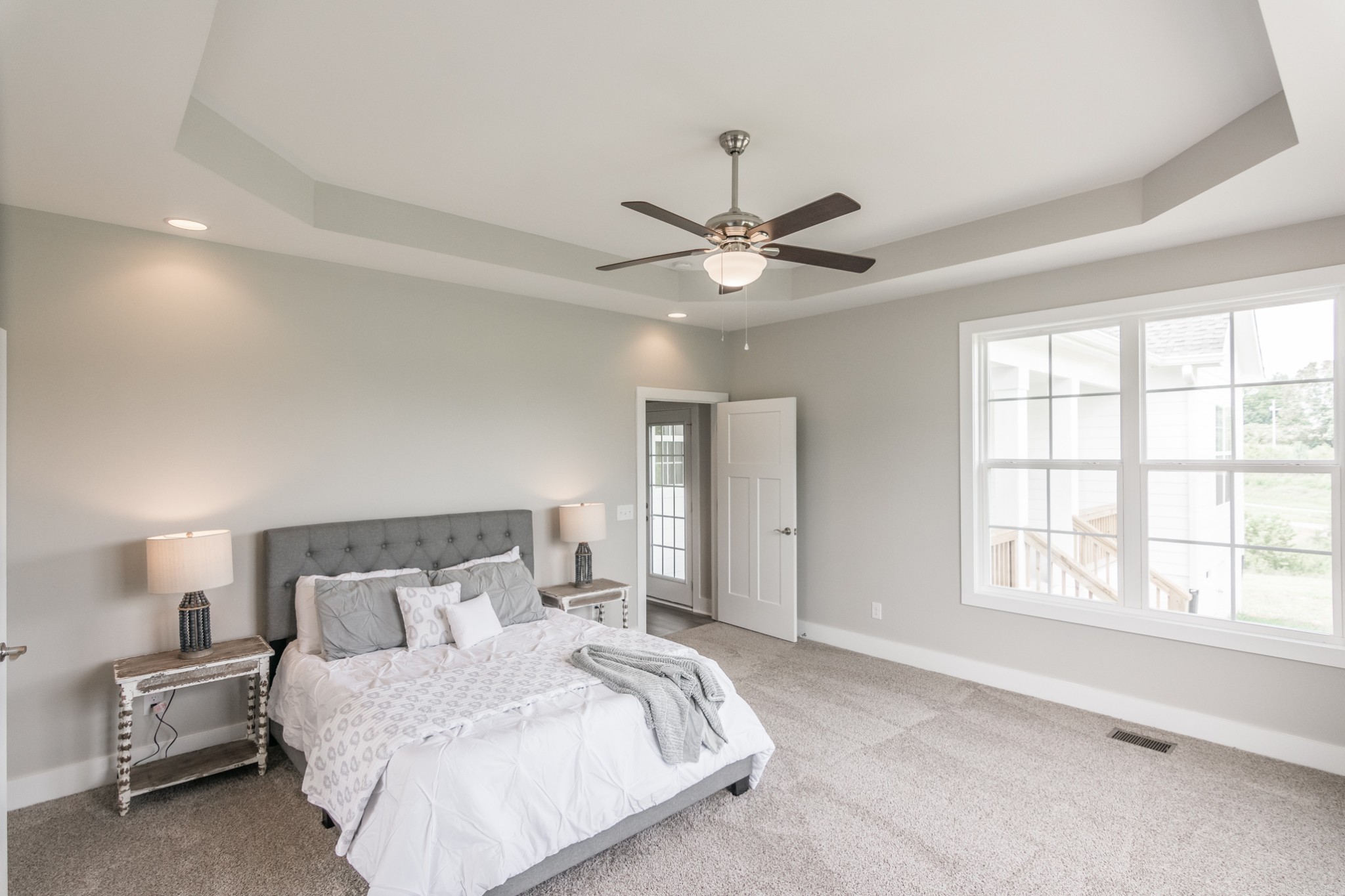 7866 Mill Road Cross Plains, TN 37049 - Photo 24 of 42 a bedroom with a large bed and a chandelier