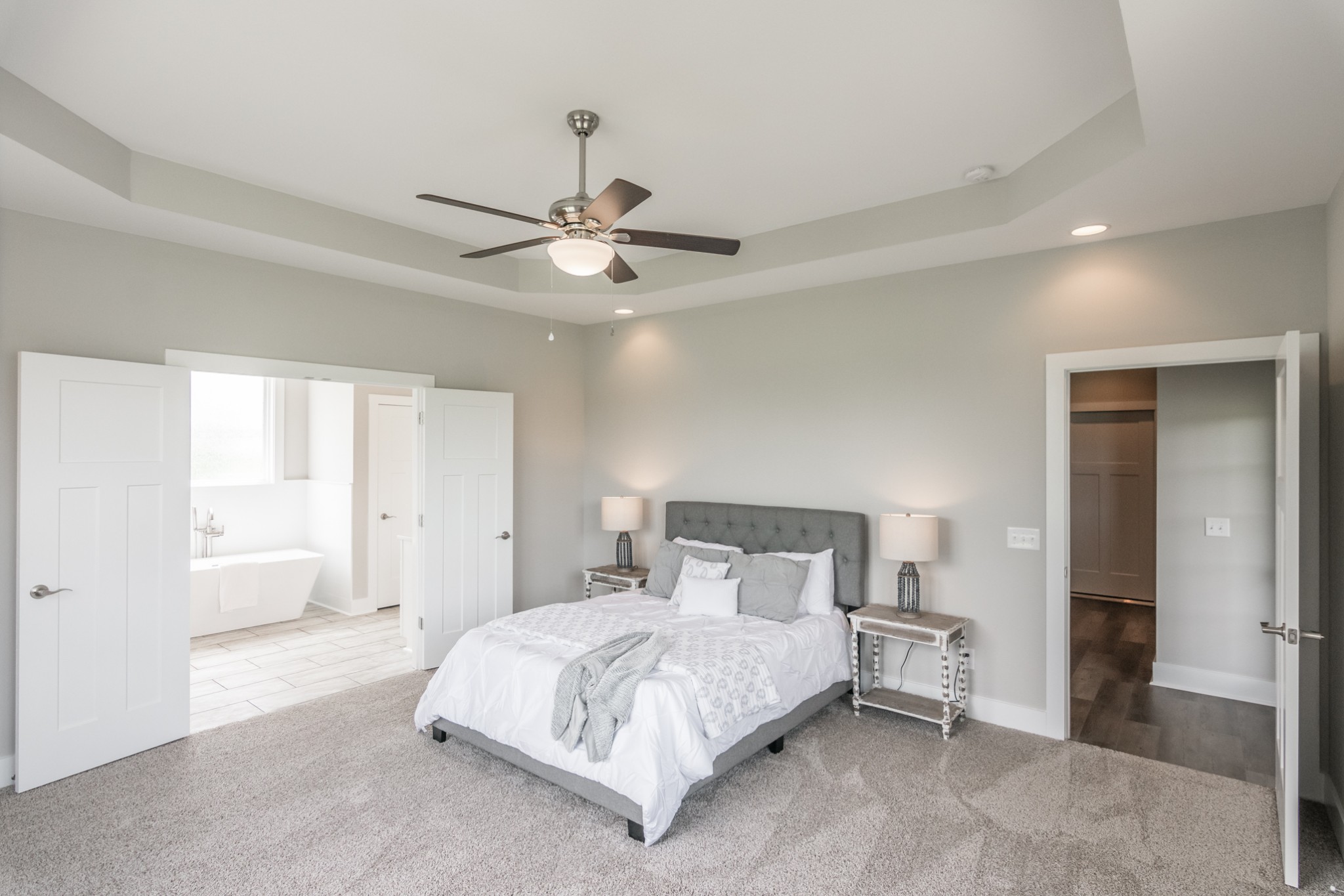 7866 Mill Road Cross Plains, TN 37049 - Photo 25 of 42 a bedroom with a large bed and a ceiling fan