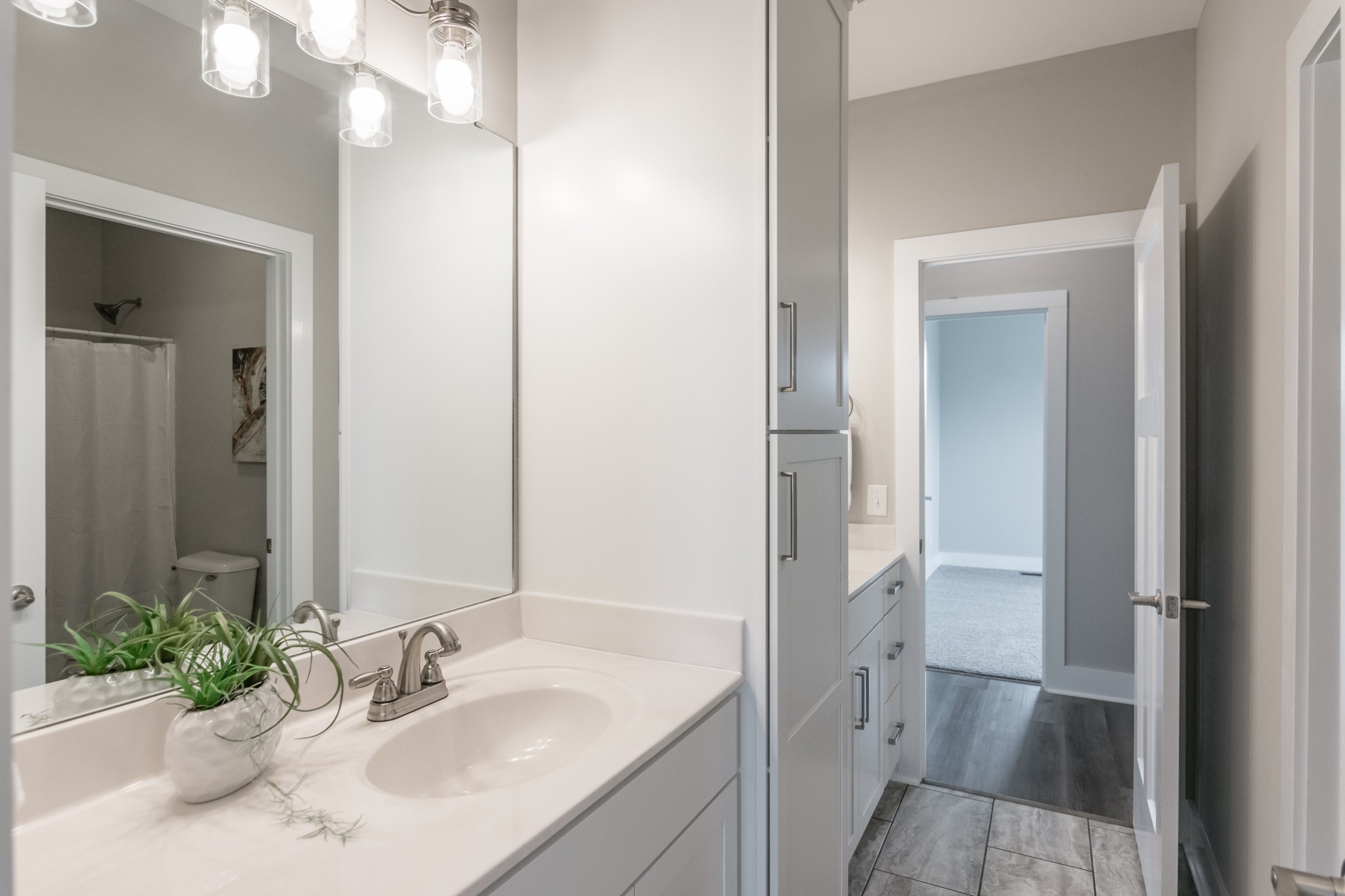 7866 Mill Road Cross Plains, TN 37049 - Photo 35 of 42 a bathroom with a sink and a mirror