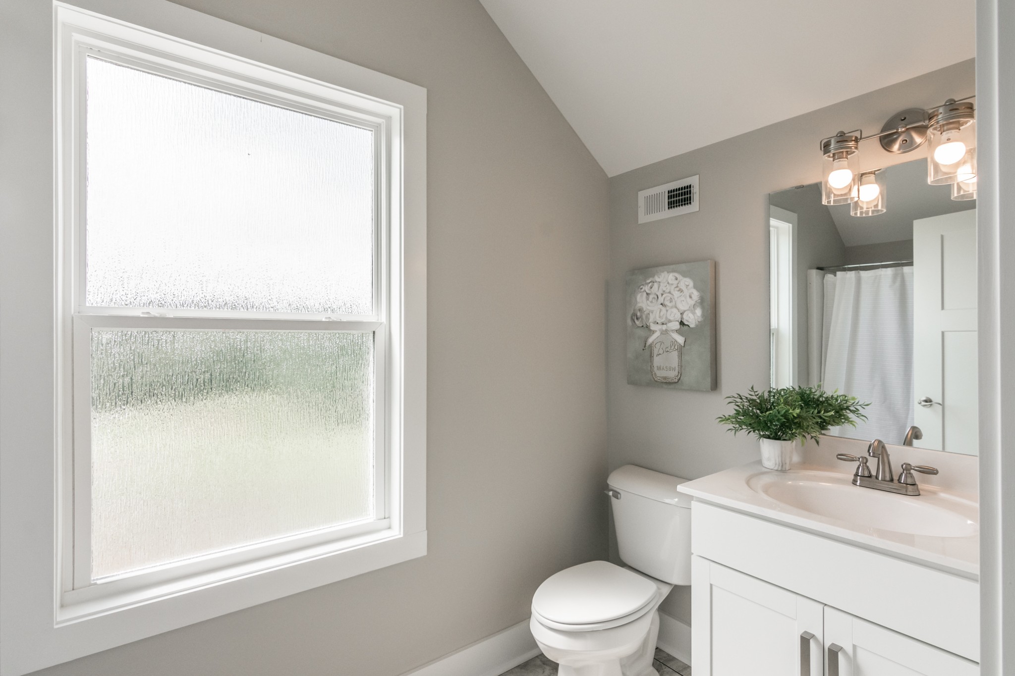 7866 Mill Road Cross Plains, TN 37049 - Photo 39 of 42 a bathroom with a sink vanity mirror and toilet