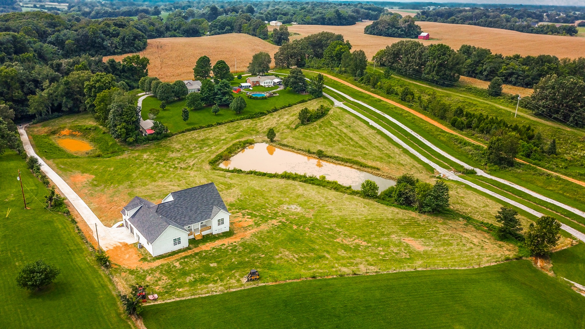 7866 Mill Road Cross Plains, TN 37049 - Photo 4 of 42 an aerial view of a house with a swimming pool