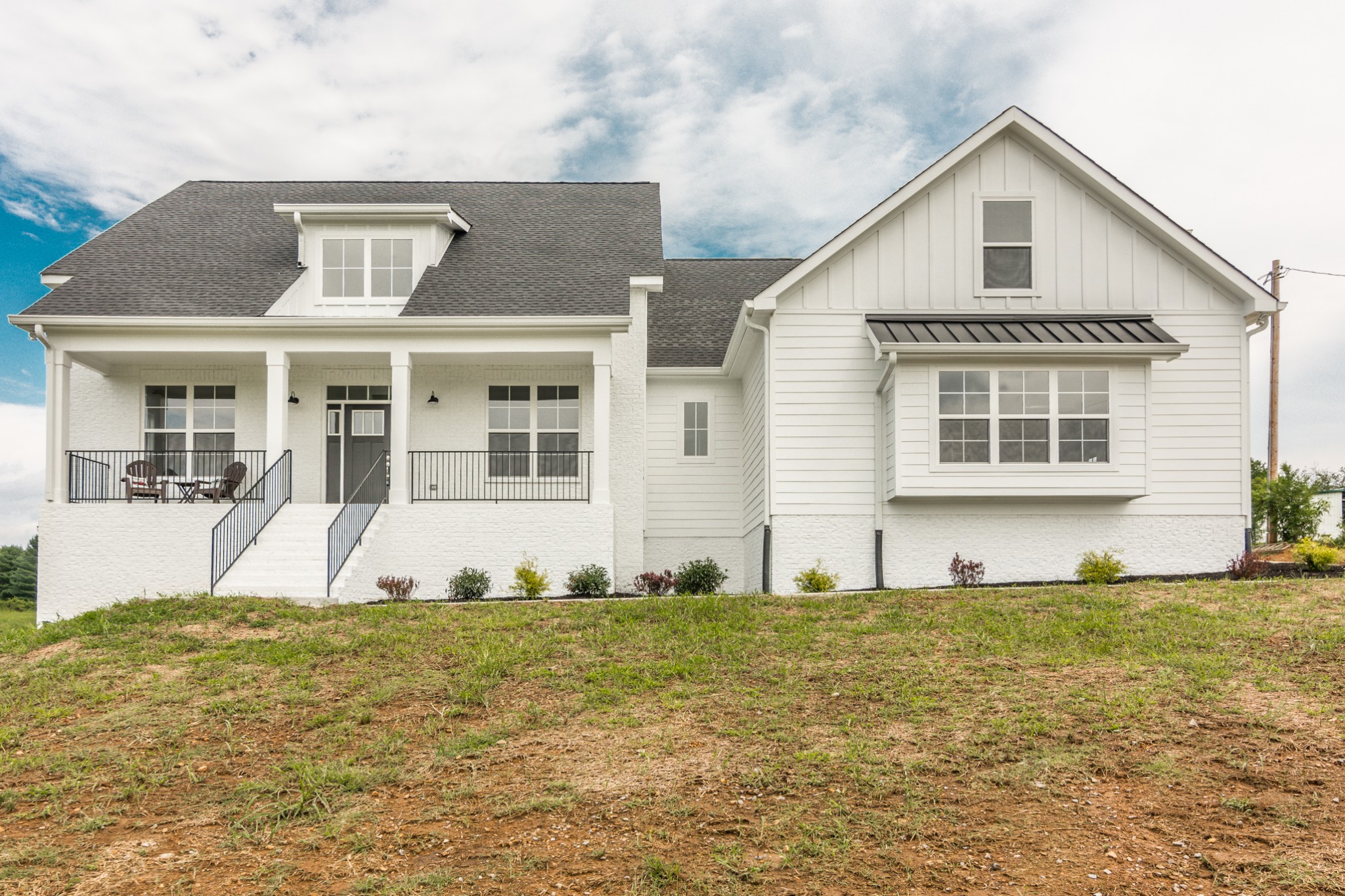7866 Mill Road Cross Plains, TN 37049 - Photo 5 of 42 a front view of a house with a yard
