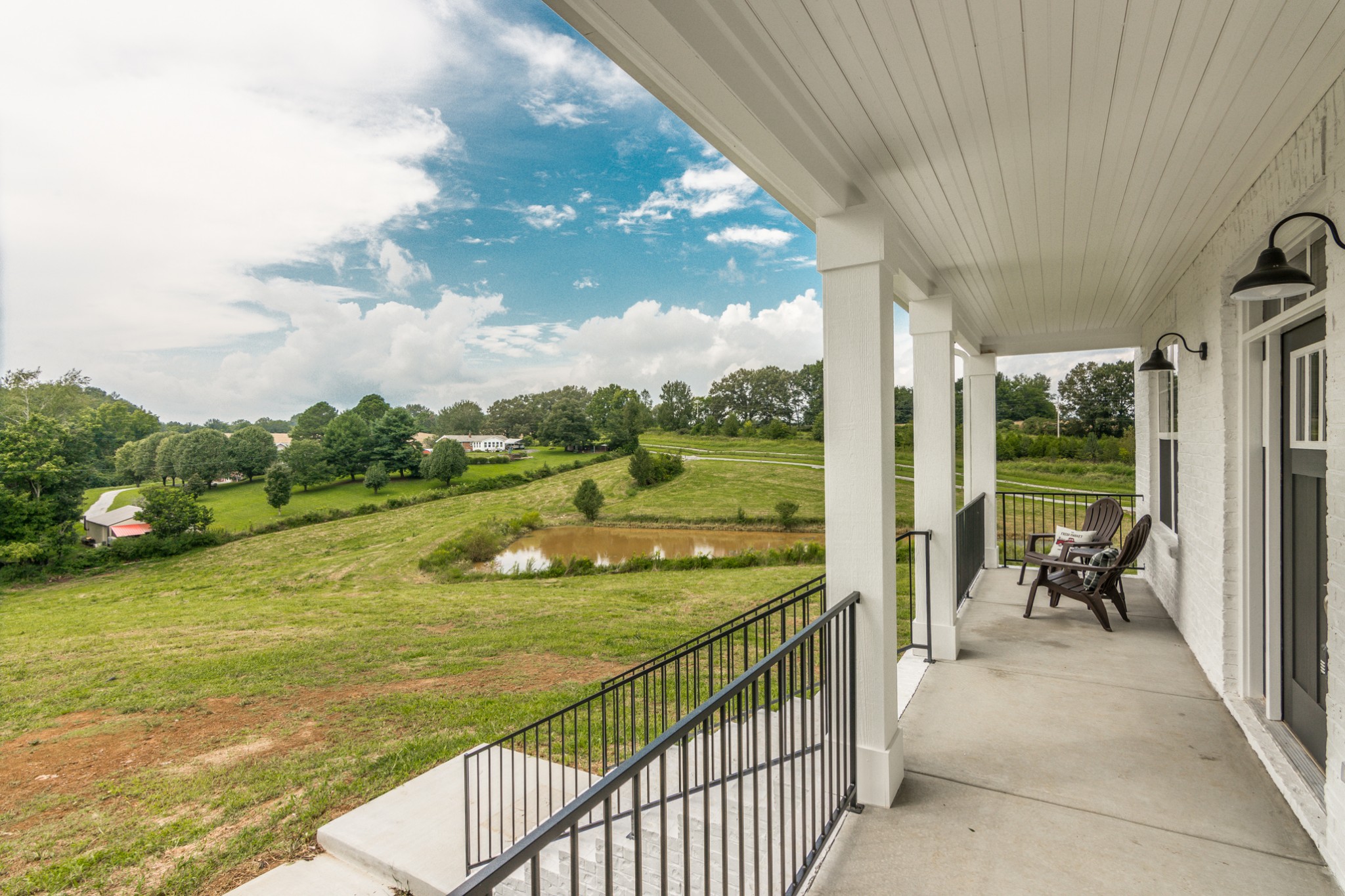 7866 Mill Road Cross Plains, TN 37049 - Photo 7 of 42 a view of a balcony with lake view and a floor to ceiling window