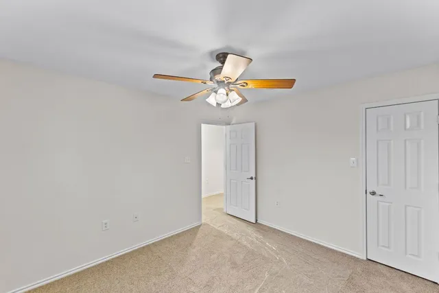 a very nice looking room with a ceiling fan