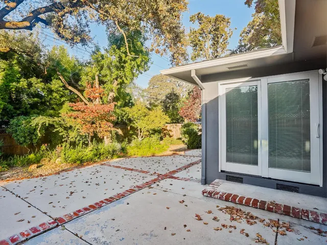 a view of a house with swimming pool and porch