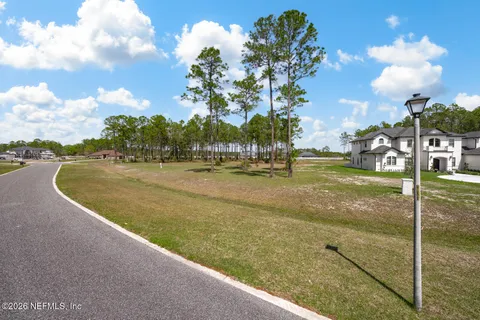 a view of a swimming pool and trees in the background