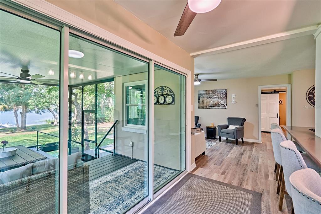 113 Stock Avenue Interlachen, FL 32148 - Photo 15 of 62 a living room with furniture tv and a large window
