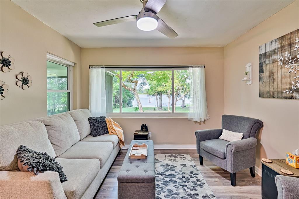 113 Stock Avenue Interlachen, FL 32148 - Photo 17 of 62 a living room with furniture and a large window