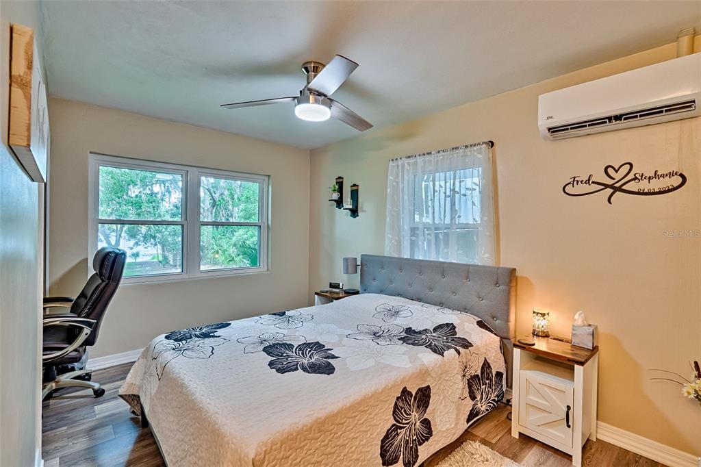 113 Stock Avenue Interlachen, FL 32148 - Photo 19 of 62 a bedroom with a bed and a window