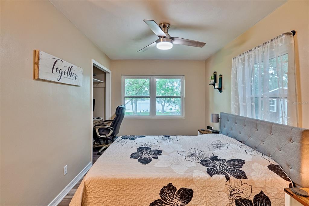 113 Stock Avenue Interlachen, FL 32148 - Photo 20 of 62 a bed sitting in a bedroom next to a window
