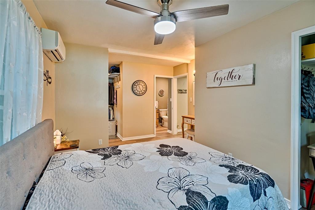 113 Stock Avenue Interlachen, FL 32148 - Photo 21 of 62 a bedroom with a bed and a dresser