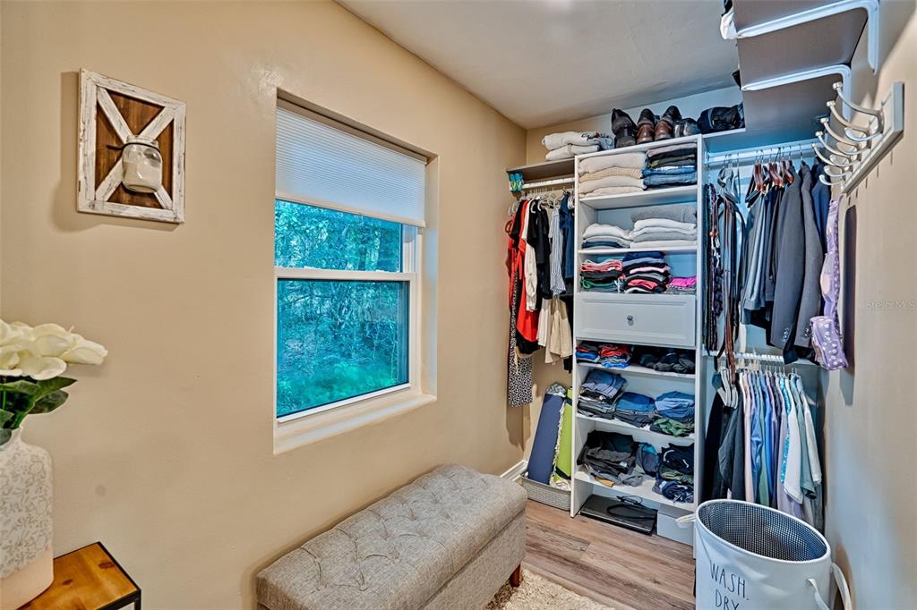 113 Stock Avenue Interlachen, FL 32148 - Photo 23 of 62 a view of walk in closet with clothes and shoes