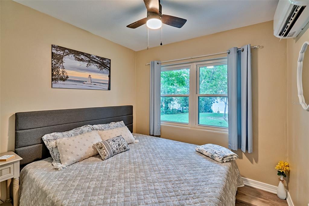 113 Stock Avenue Interlachen, FL 32148 - Photo 24 of 62 a bedroom with a bed and a window