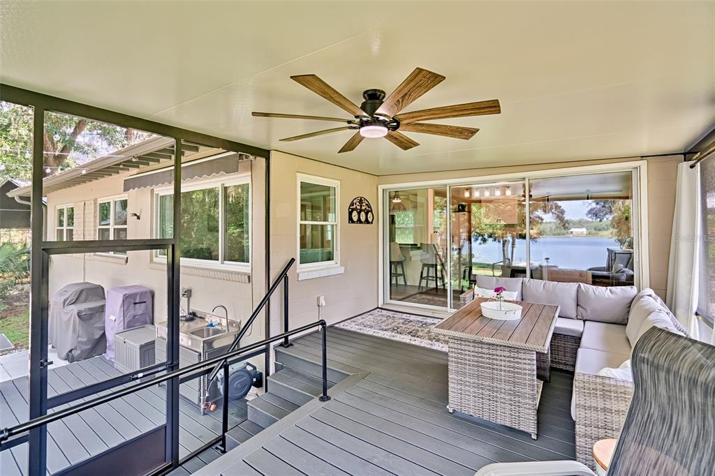 113 Stock Avenue Interlachen, FL 32148 - Photo 28 of 62 a living room with furniture and a large window