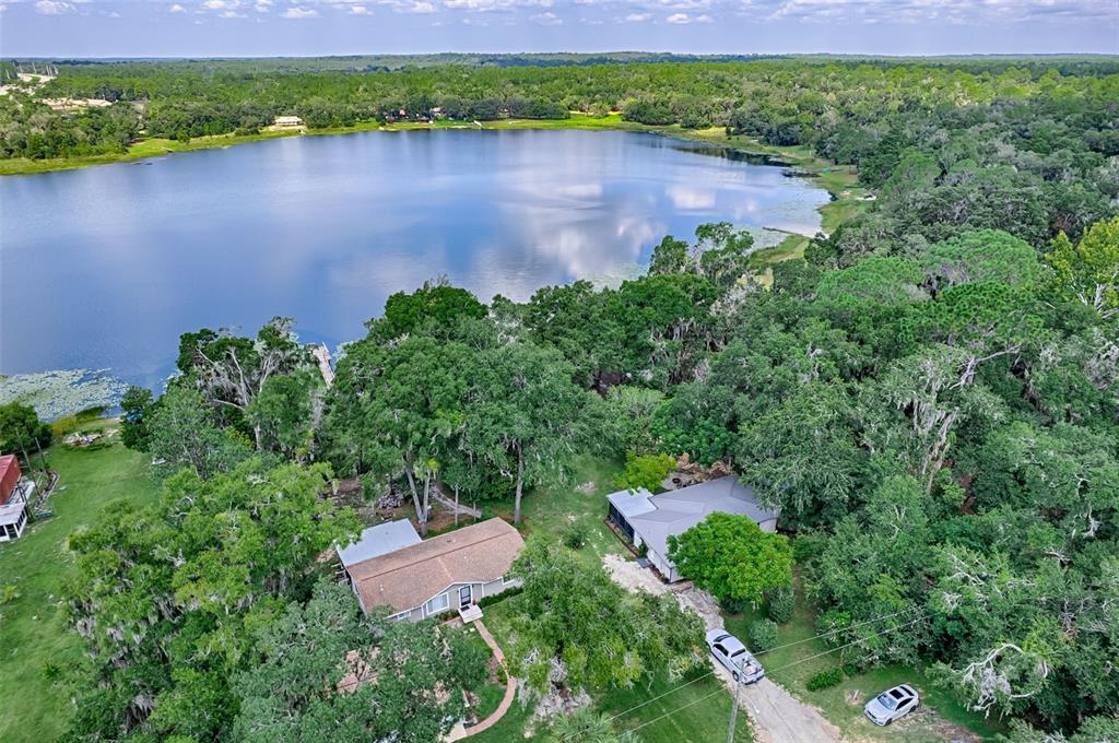 113 Stock Avenue Interlachen, FL 32148 - Photo 3 of 62 an aerial view of a house with a yard and a yard