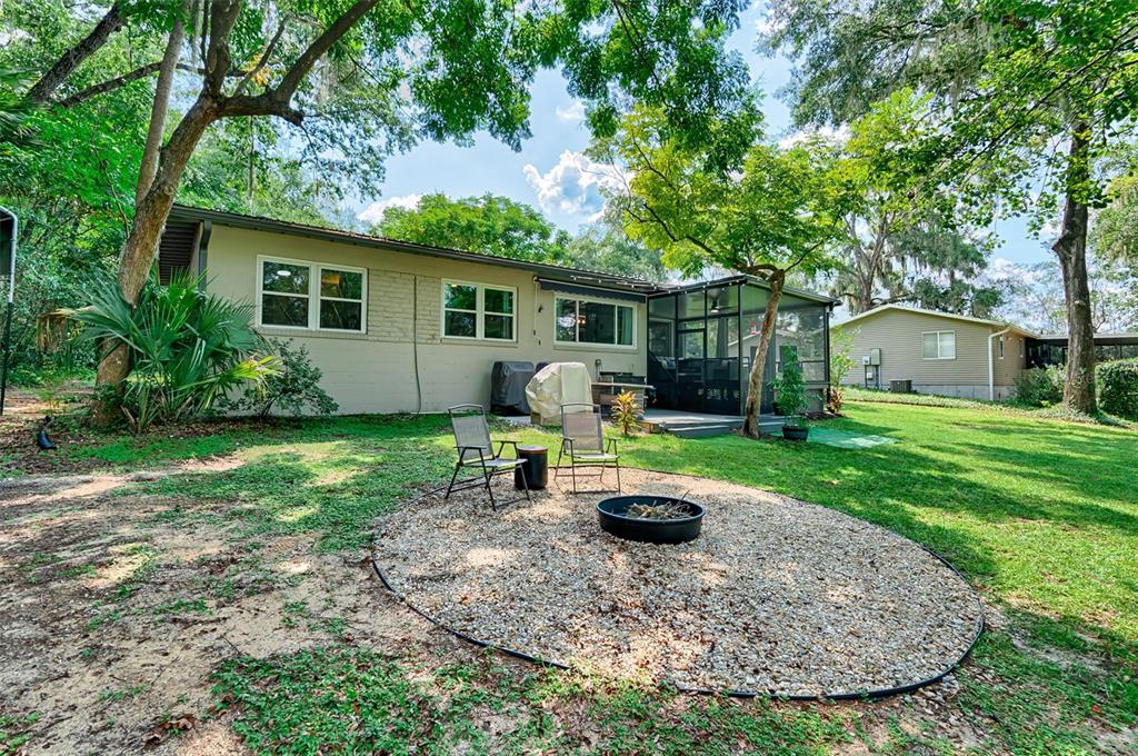 113 Stock Avenue Interlachen, FL 32148 - Photo 32 of 62 a view of a house with backyard
