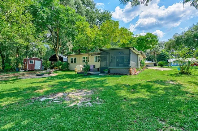 a view of a lake with houses in the back