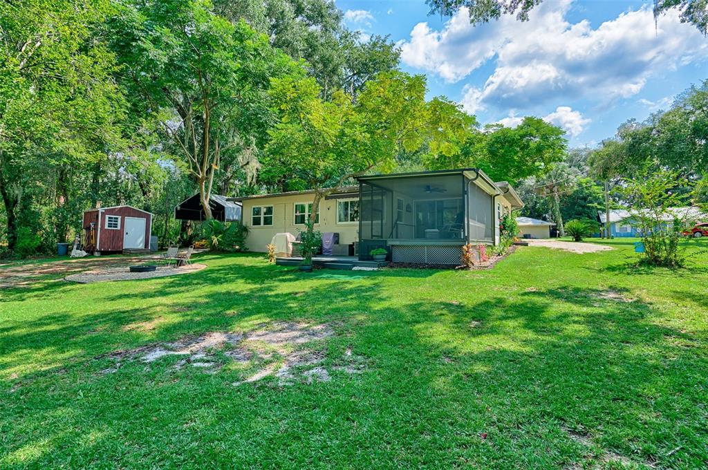 113 Stock Avenue Interlachen, FL 32148 - Photo 33 of 62 a house view with a garden space