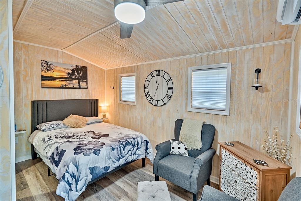 113 Stock Avenue Interlachen, FL 32148 - Photo 39 of 62 a bedroom with a bed couch and a window