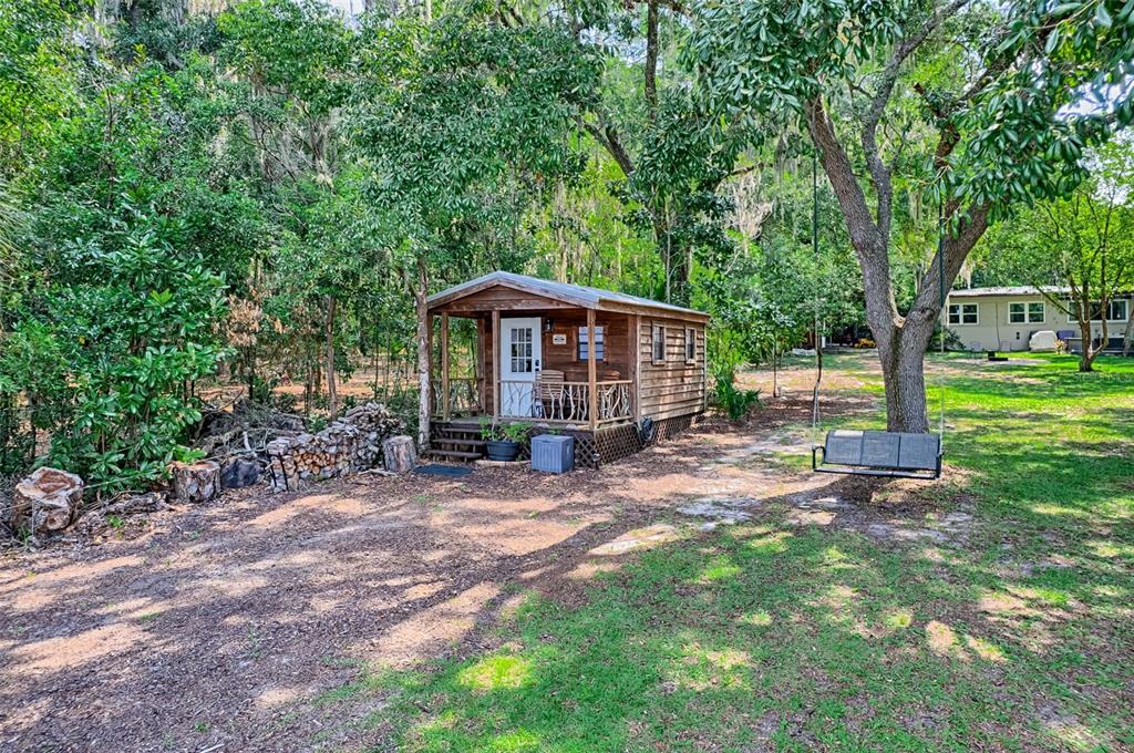 113 Stock Avenue Interlachen, FL 32148 - Photo 52 of 62 a view of a house with backyard and a tree