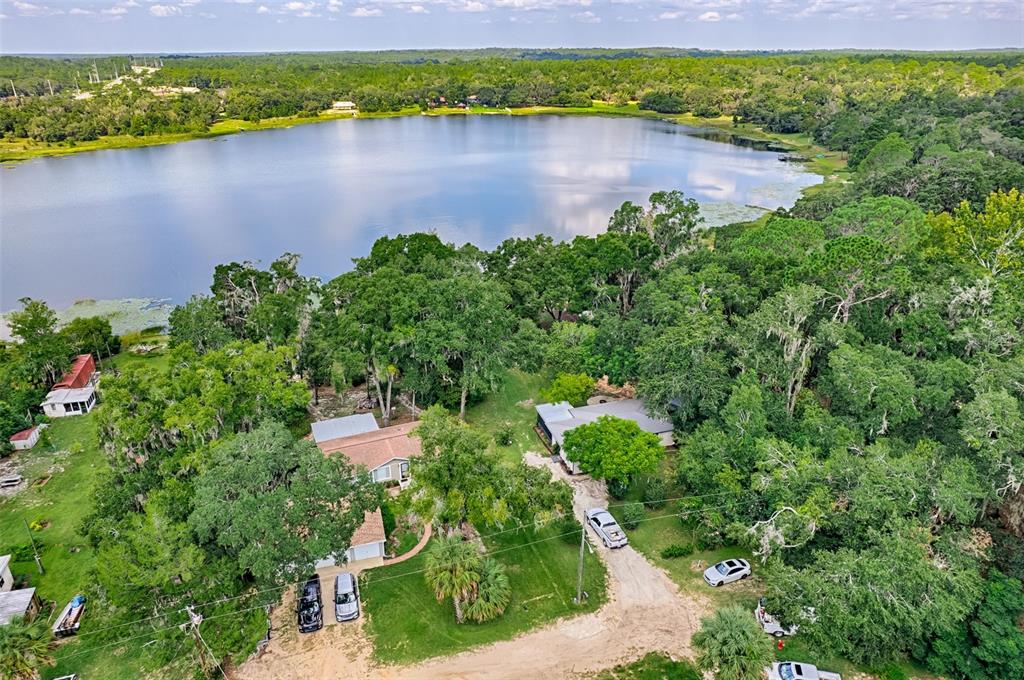 113 Stock Avenue Interlachen, FL 32148 - Photo 54 of 62 a view of a lake with a house