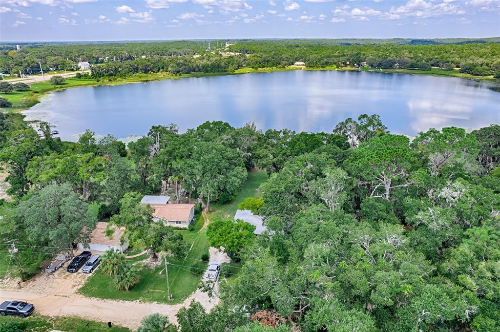 113 Stock Avenue Interlachen, FL 32148 - Photo 56 of 62 an aerial view of a house with a yard and lake view