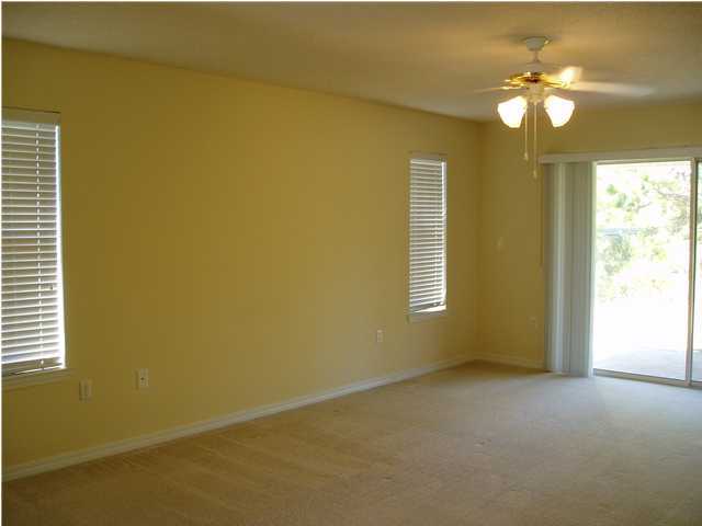 6894 Fernandina Road Navarre, FL 32566 - Photo 11 of 17 a view of a livingroom with painted walls
