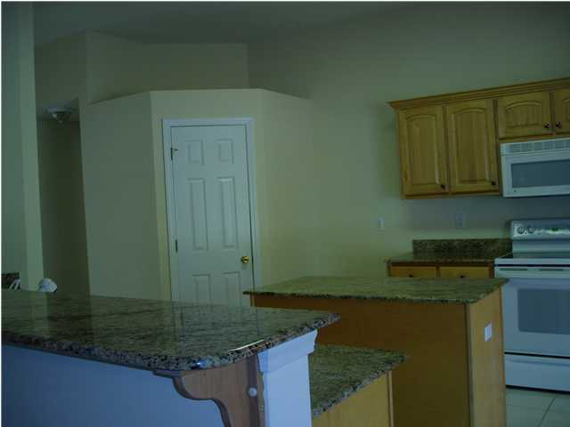 6894 Fernandina Road Navarre, FL 32566 - Photo 6 of 17 a kitchen with a sink