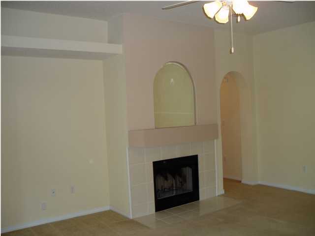 6894 Fernandina Road Navarre, FL 32566 - Photo 9 of 17 a living room with furniture and a fireplace