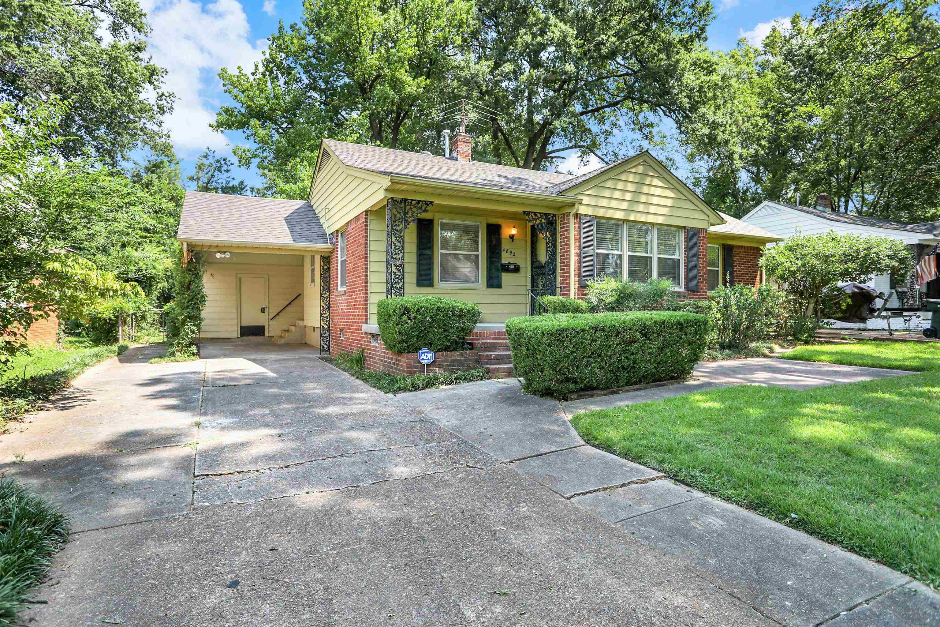 4892 Amboy Road Memphis, TN 38117 - Photo 1 of 26 a front view of a house with a yard
