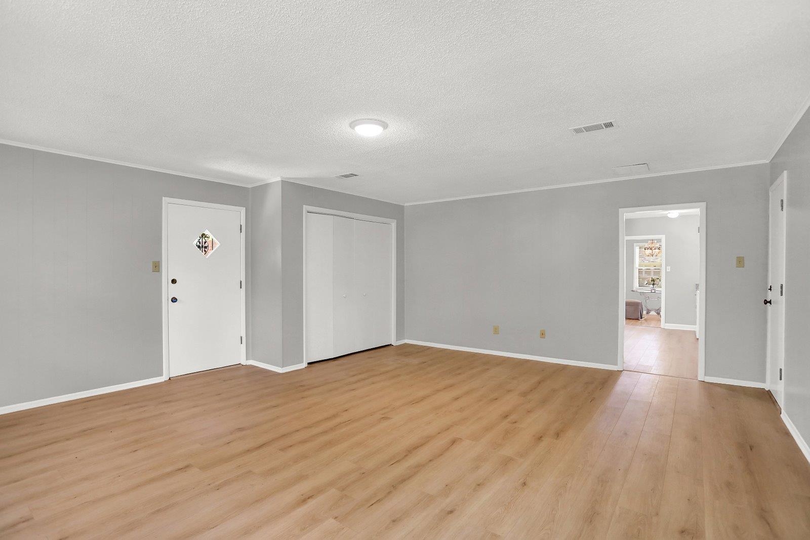 4892 Amboy Road Memphis, TN 38117 - Photo 12 of 26 a view of an empty room and wooden floor