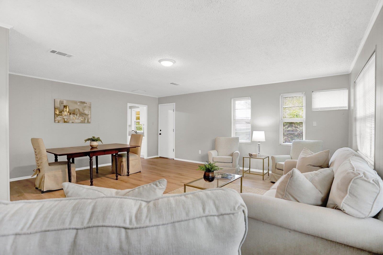 4892 Amboy Road Memphis, TN 38117 - Photo 17 of 26 a living room with furniture and a wooden floor